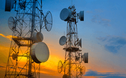Telecommunication towers at sunset